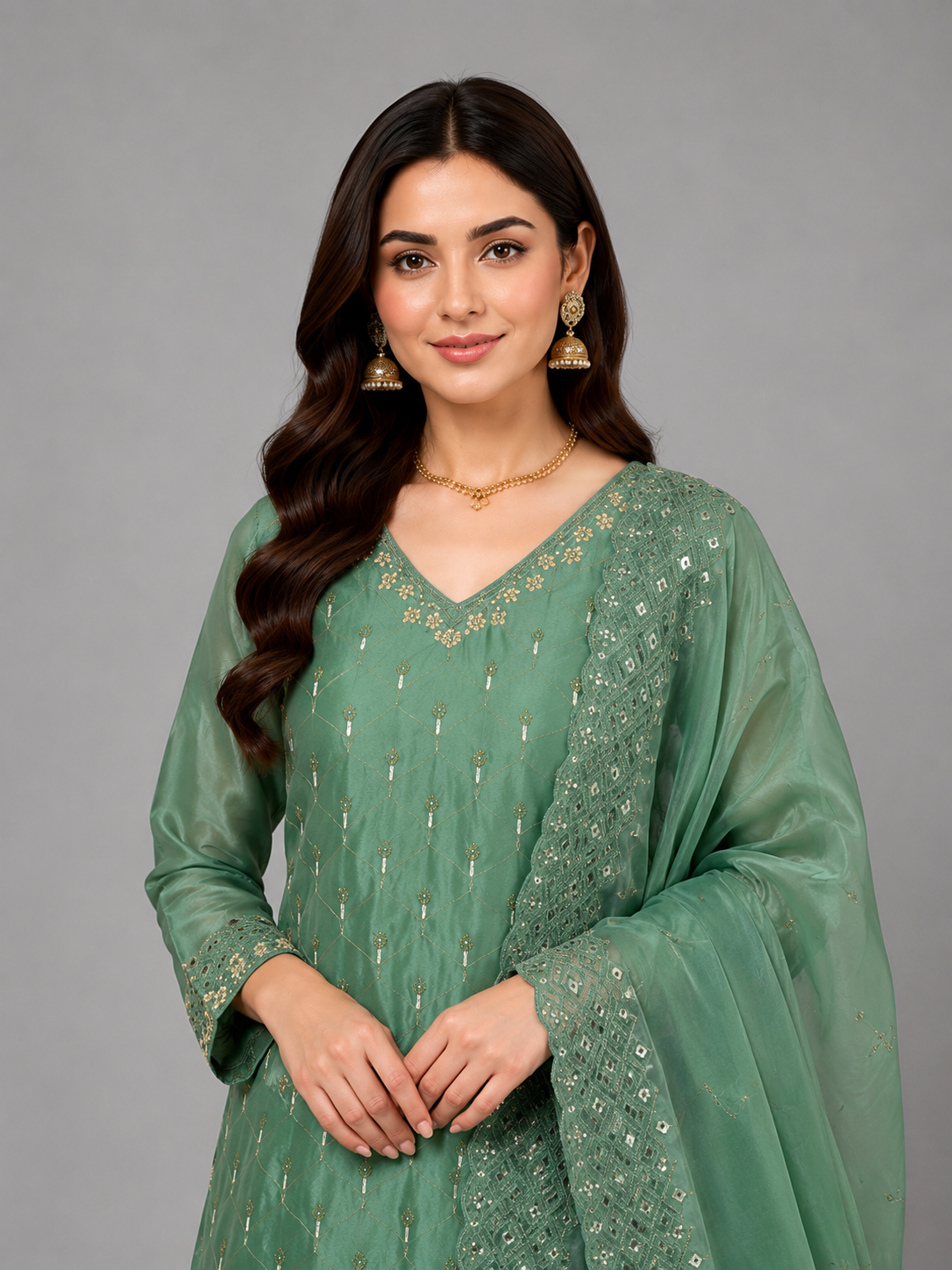 Regal Green Festive Set Featuring Intricate Embellishments